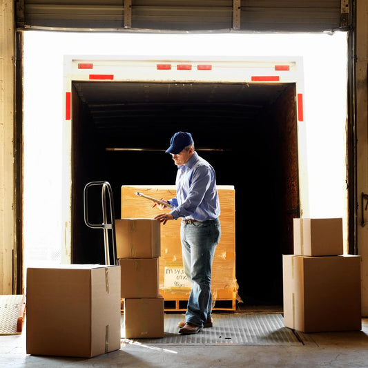 Nomad Moving Company employee meticulously inspects a customer's property in our warehouse, ensuring safe and secure handling before local moving to its final destination in Lexington and Louisville, KY.